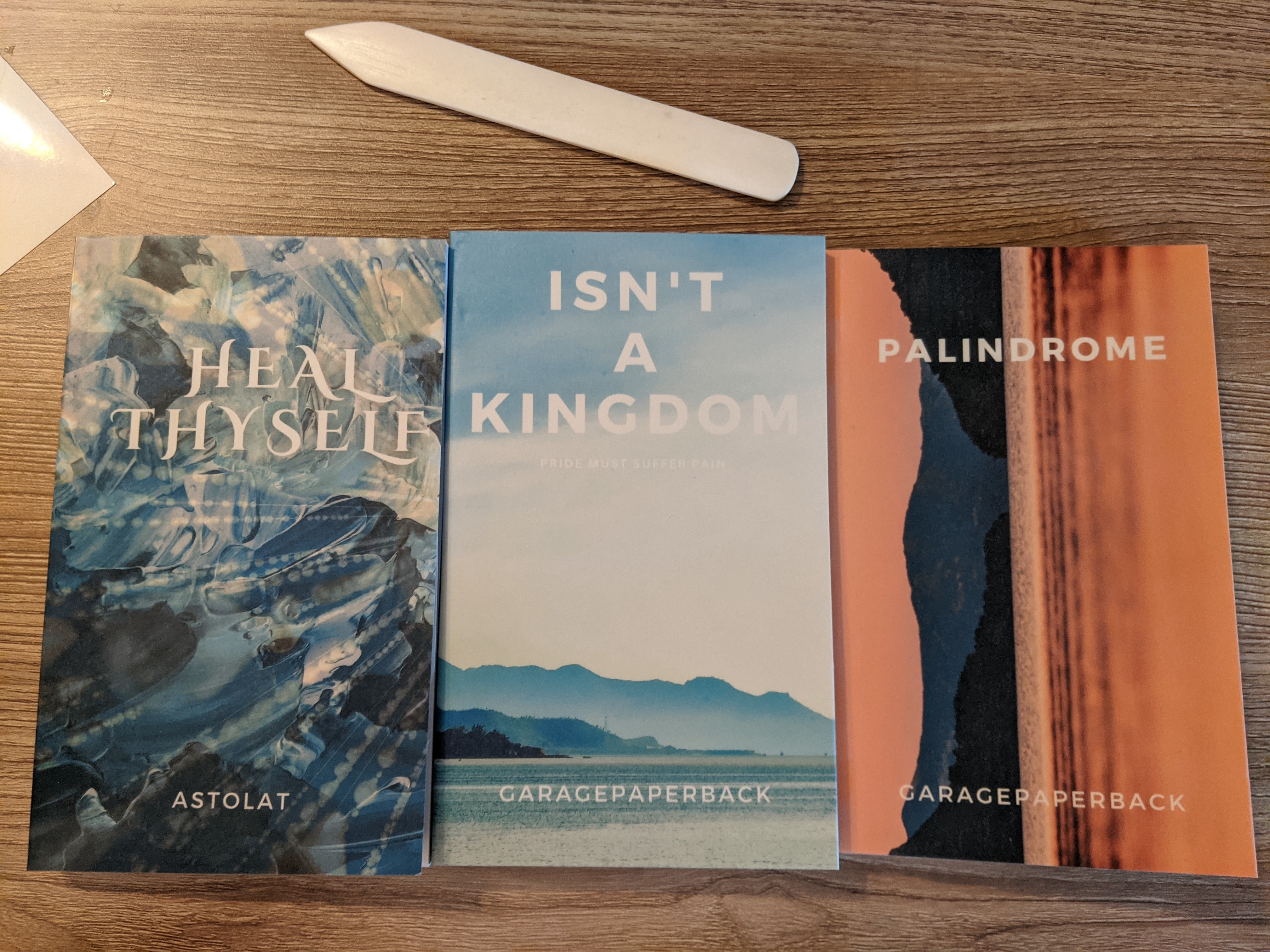 Three paperback handbound books