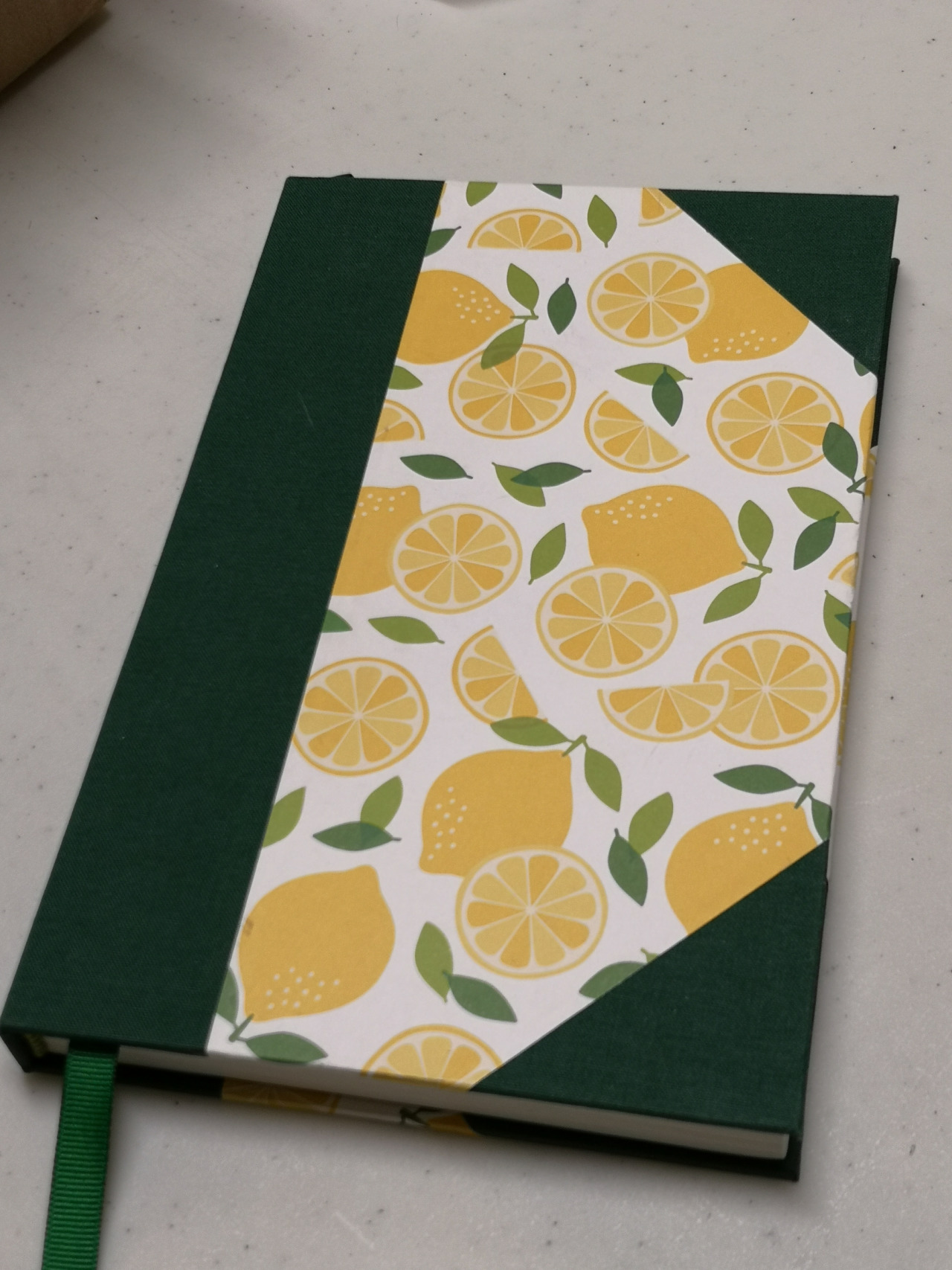 A handbound book with lemons on the cover